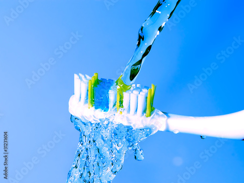 toothbrush under the running water