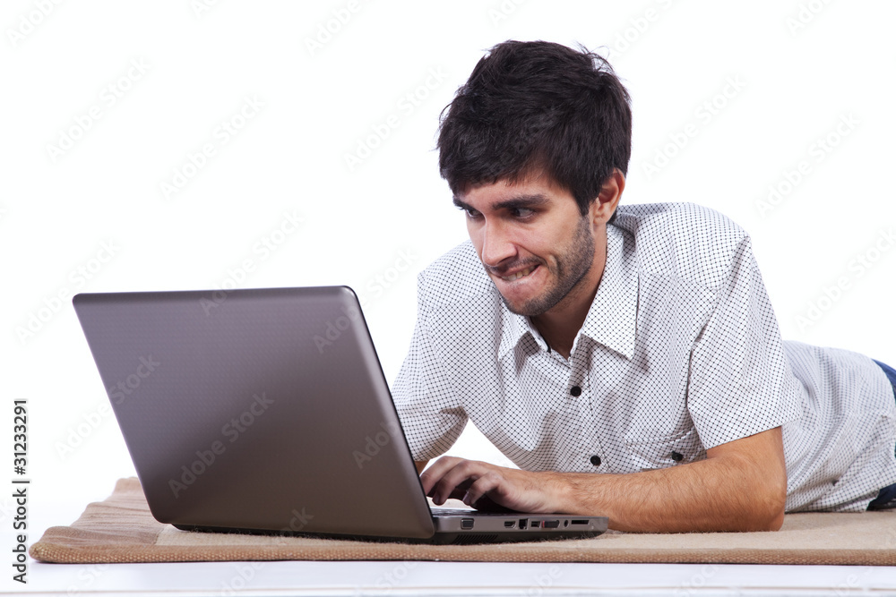 Happy young man surfing the internet Happy young man surfing the internet