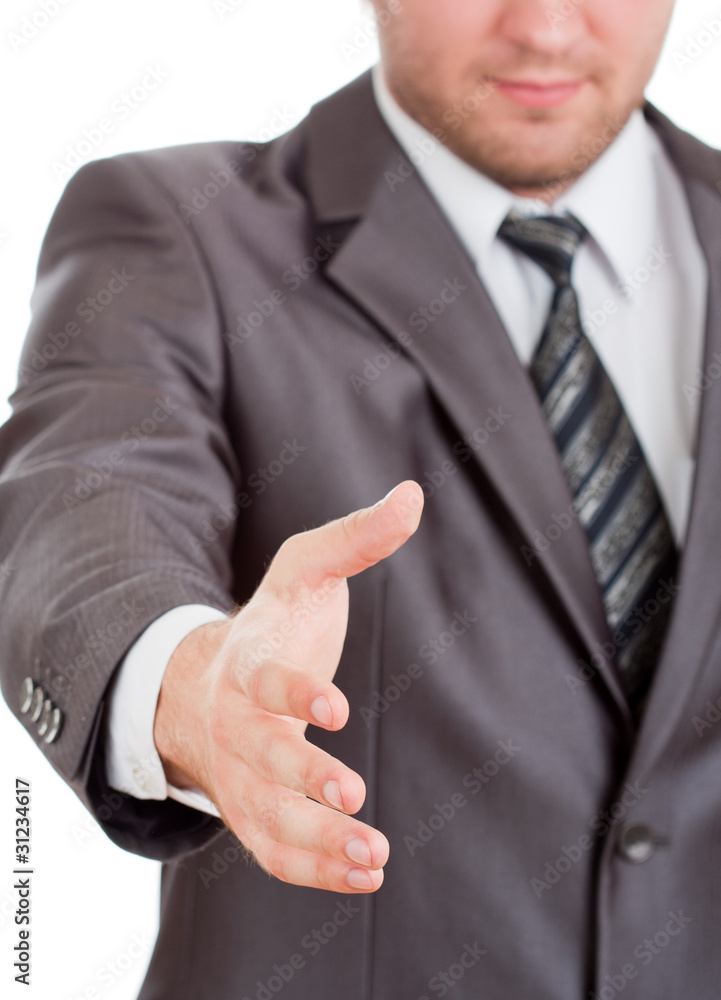 Smiling businessman is going to handshake Smiling businessman is going to handshake