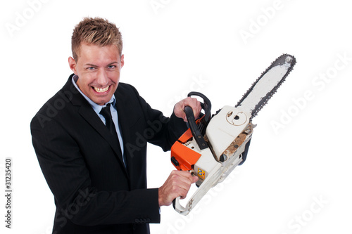 Young businessman with chainsaw