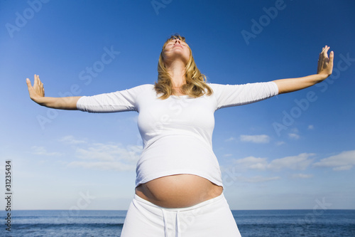 Embarazada Estirandose en la Playa photo