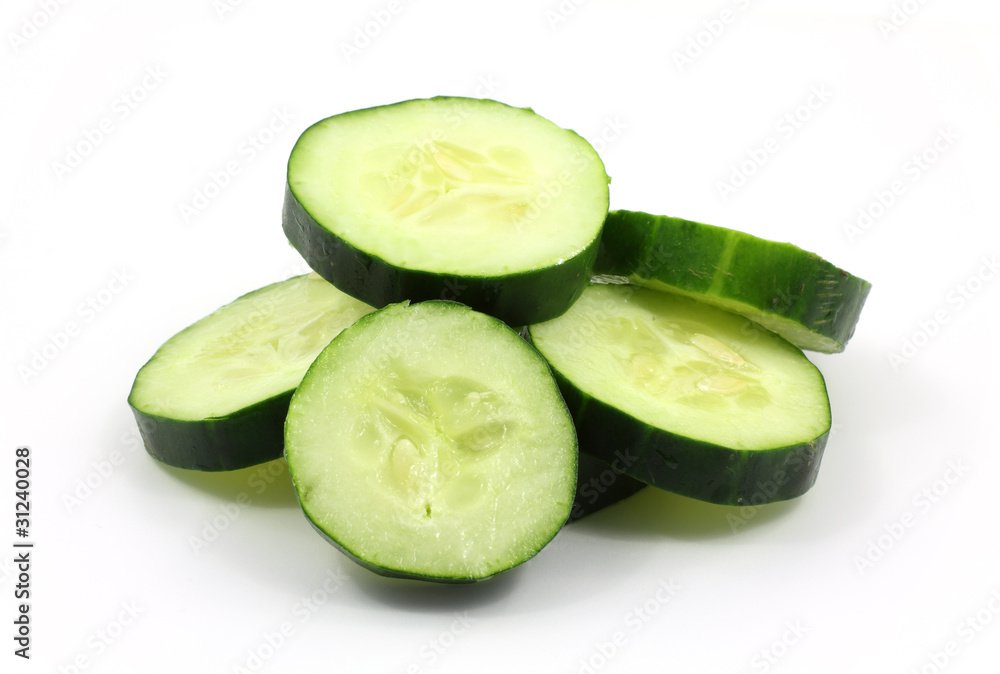 Sliced organic cucumbers on white background Sliced organic cucumbers on white background