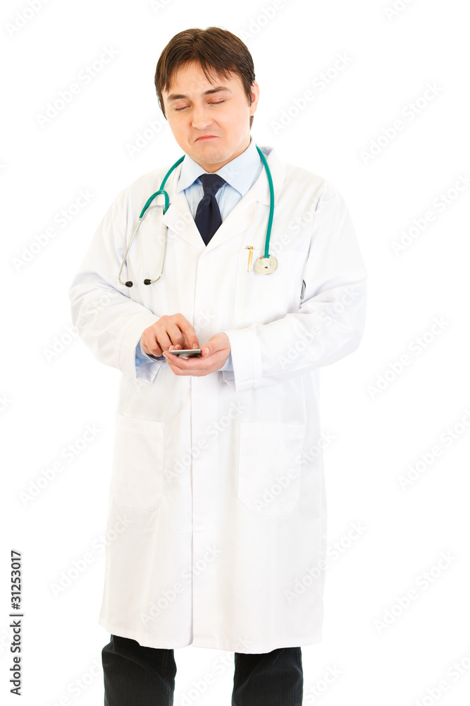 Very pleased medical doctor counting on calculator