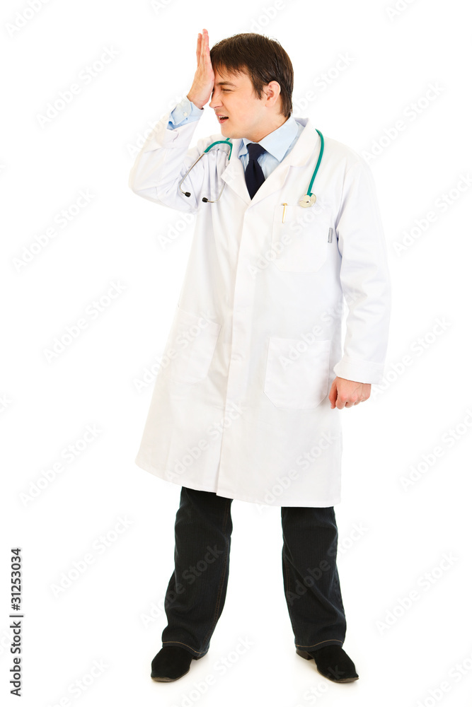Forgot something medical doctor holding his hand near forehead Forgot something medical doctor holding his hand near forehead