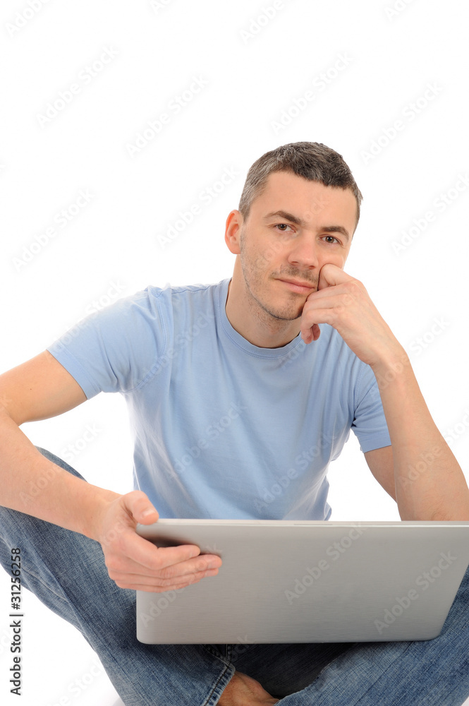 handsome young male working on laptop computer. isolated handsome young male working on laptop computer. isolated