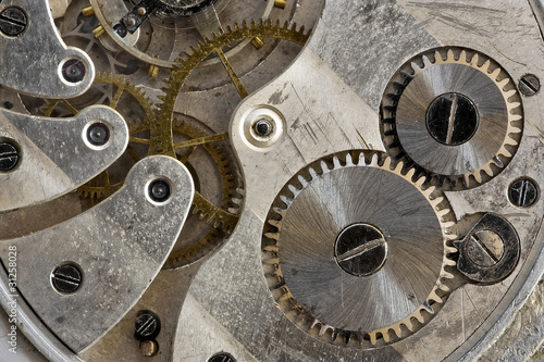 Close up view of old clock's gears .