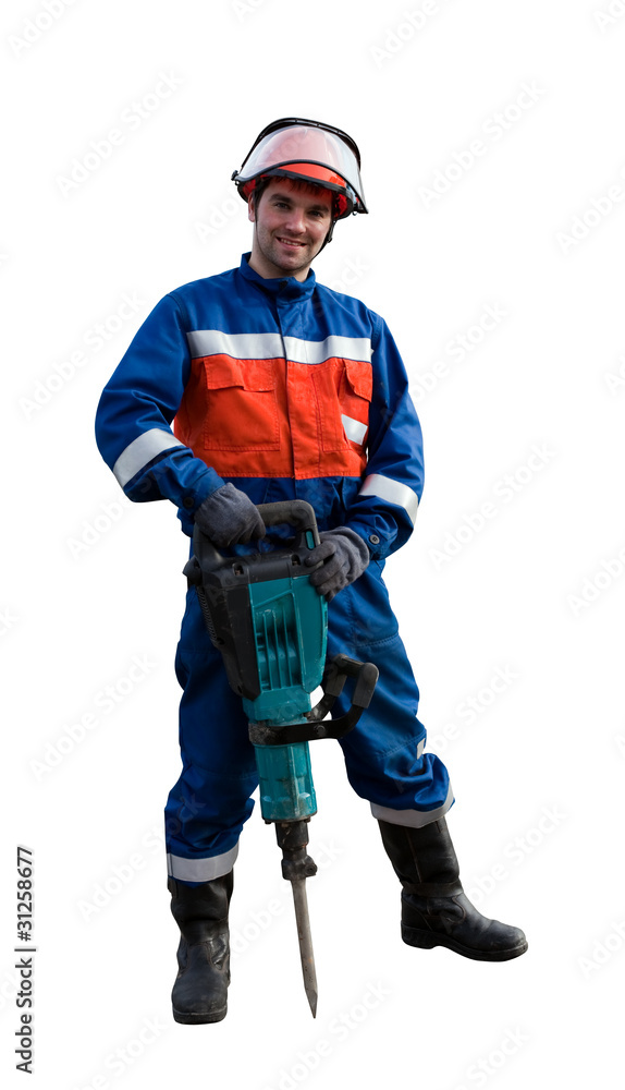 Worker in overalls with an electric hammer Worker in overalls with an electric hammer