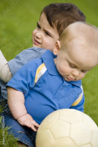 Infant And Toddler With Soccer Ball