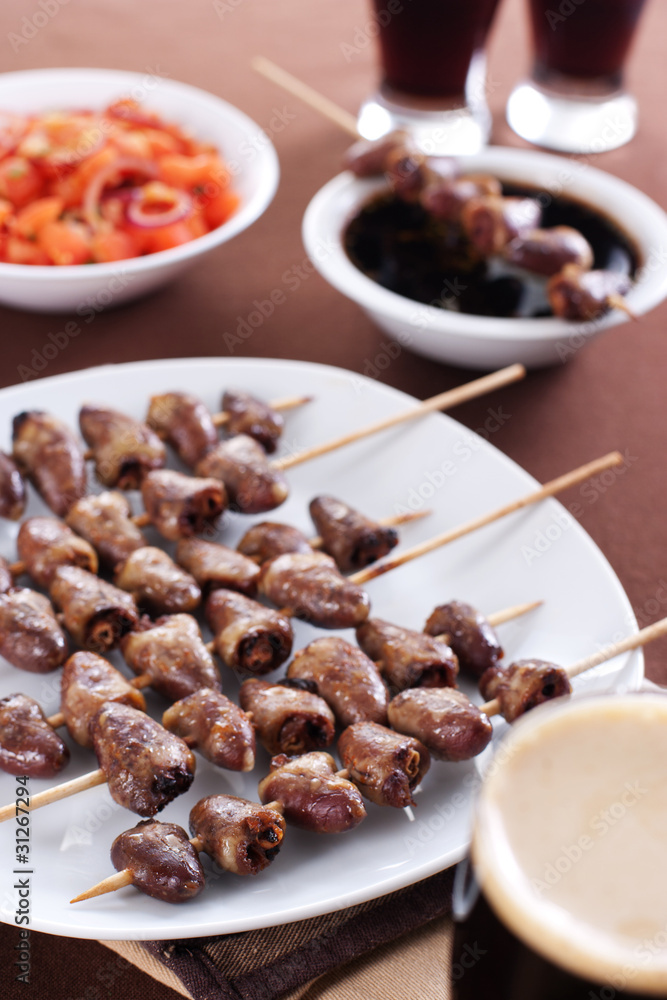 Grilled chicken hearts on skewers Grilled chicken hearts on skewers