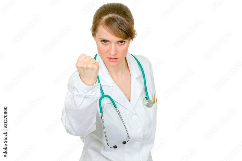 Angry medical doctor woman threaten with fist isolated Angry medical doctor woman threaten with fist isolated