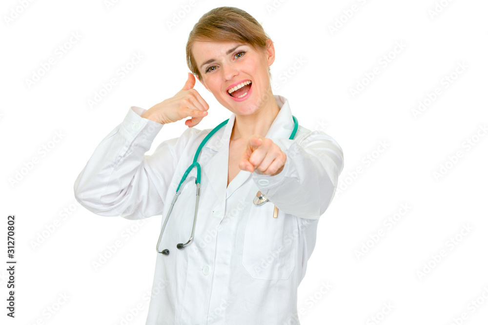 Smiling medical doctor woman showing contact me gesture Smiling medical doctor woman showing contact me gesture