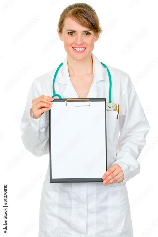 Smiling medical doctor woman holding blank clipboard Smiling medical doctor woman holding blank clipboard