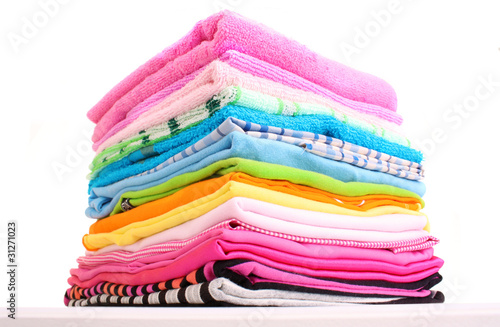 Pile of colorful clothes over white background