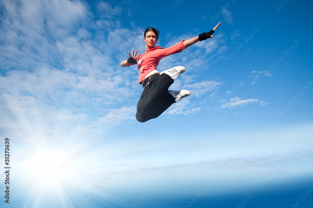 sport woman jumping and fly over sky and sun sport woman jumping and fly over sky and sun