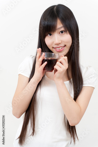 beautiful asian woman with a cup of tea