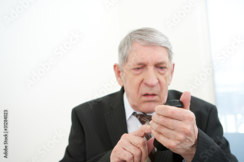 Old businessman making a phone call