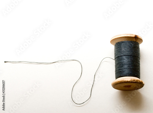 Thread bobbin on white background