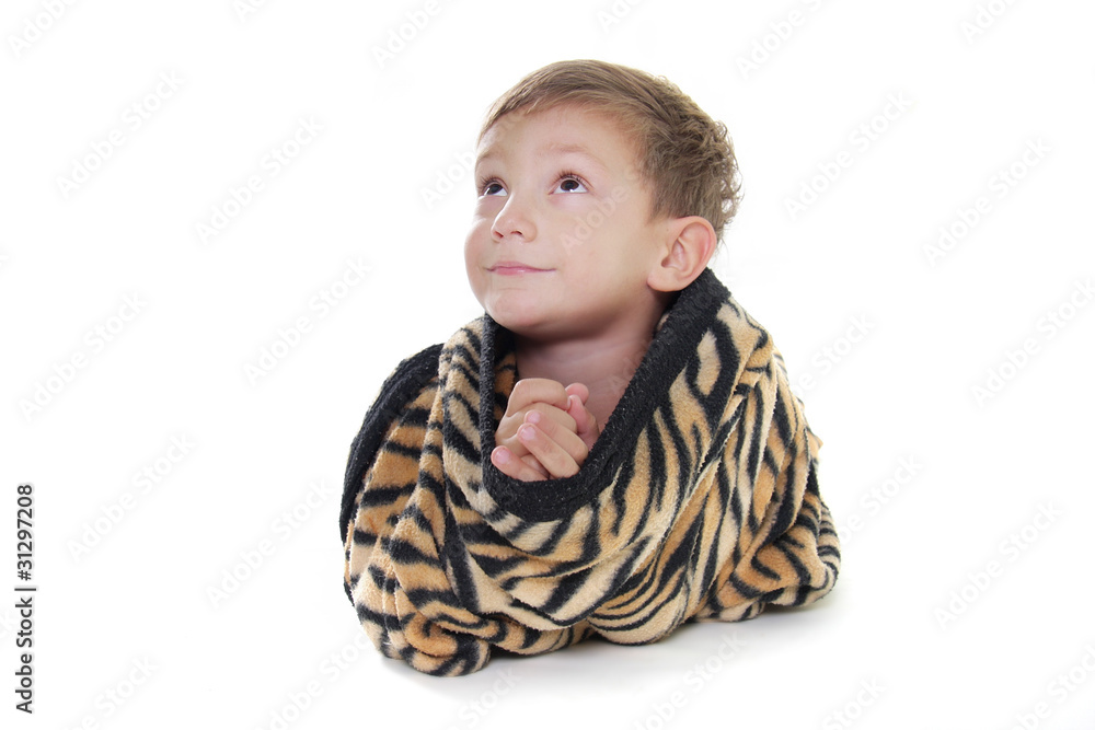 young cute boy wraped up with counterpane over white young cute boy wraped up with counterpane over white