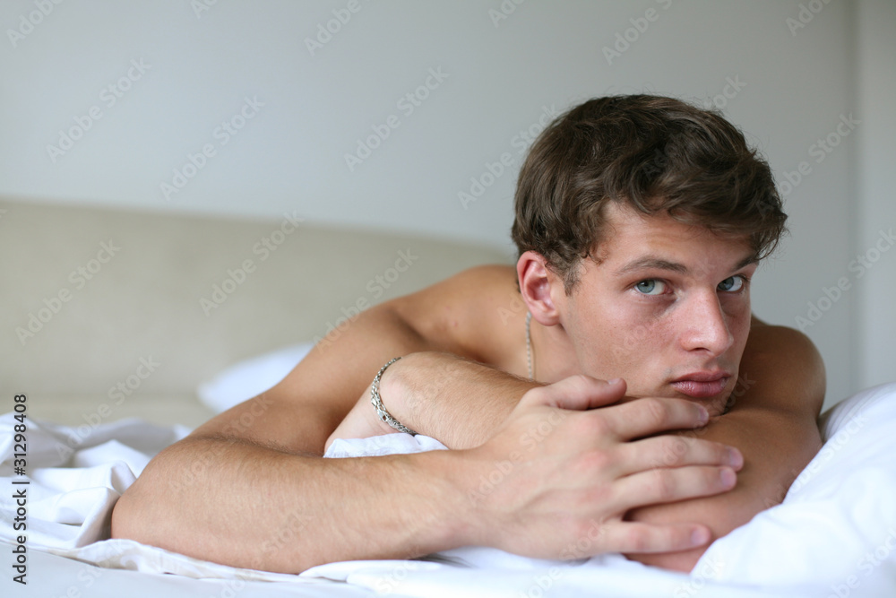 Young Sexy Man on a Bed Young Sexy Man on a Bed
