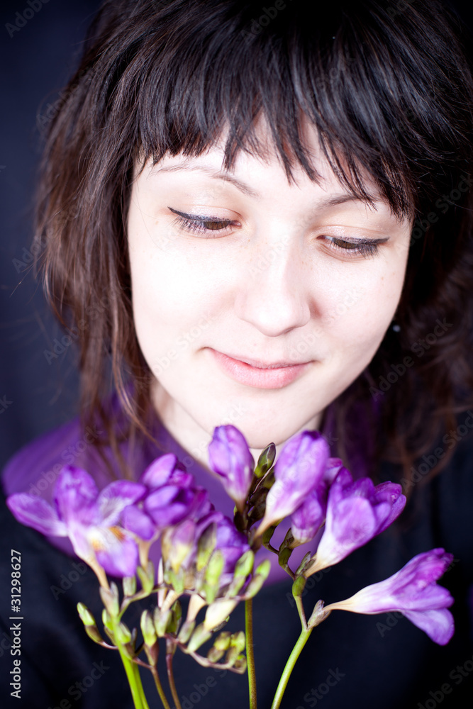 woman with purple flower