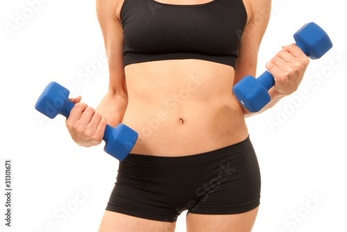 Woman working out with blue dumbbells weights
