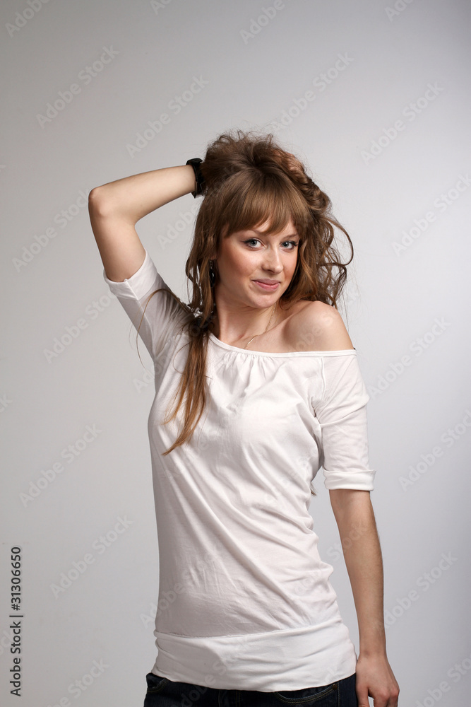 Young Smiling Girl Holding Her Hair Young Smiling Girl Holding Her Hair