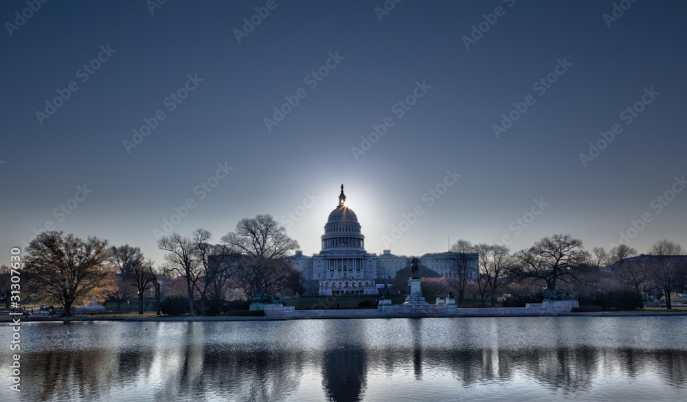 Sunrise behind the dome of the Capitol in DC