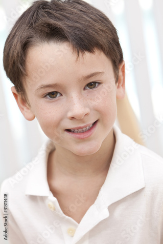 Headshot Portrait Of A Happy Smiling Young Boy