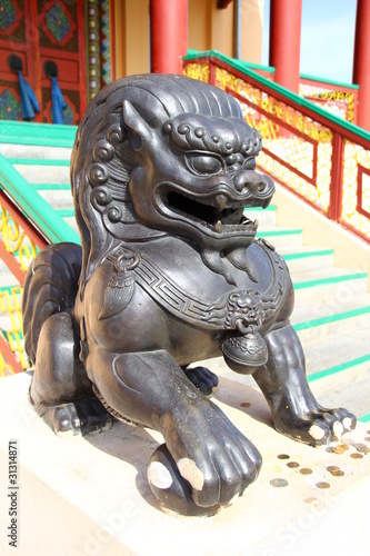 Lions guard the entrance to a Buddhist temple
