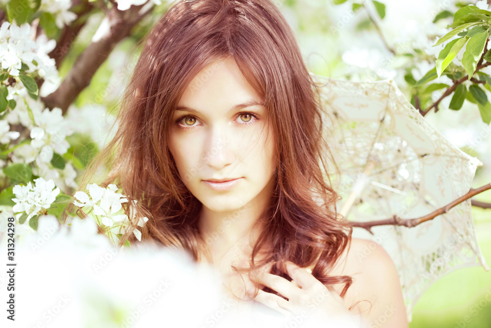 Beautiful girl in the lush spring garden Beautiful girl in the lush spring garden