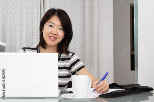 A woman working/operating business from home