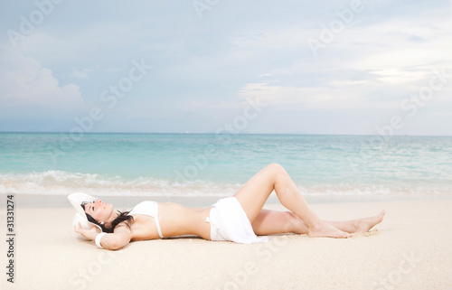Young fashion woman rest on the beach