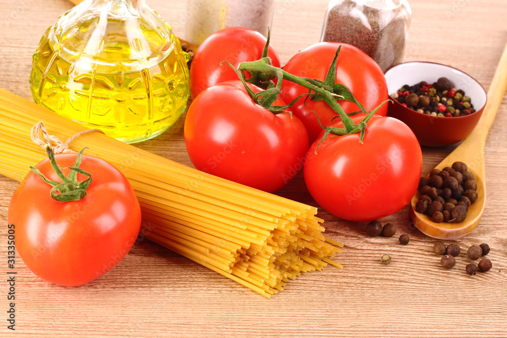 Pasta spaghetti with tomatoes, olive oil, peper and basil on a Pasta spaghetti with tomatoes, olive oil, peper and basil on a