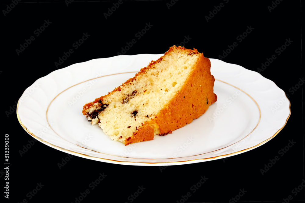 Slice of cake on black background