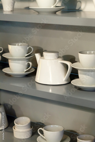 white cups on the shelf