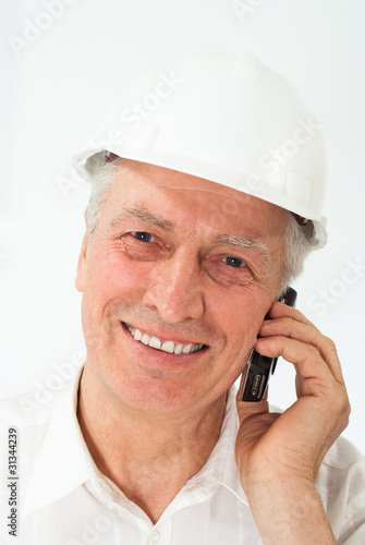 old builder in the helmet