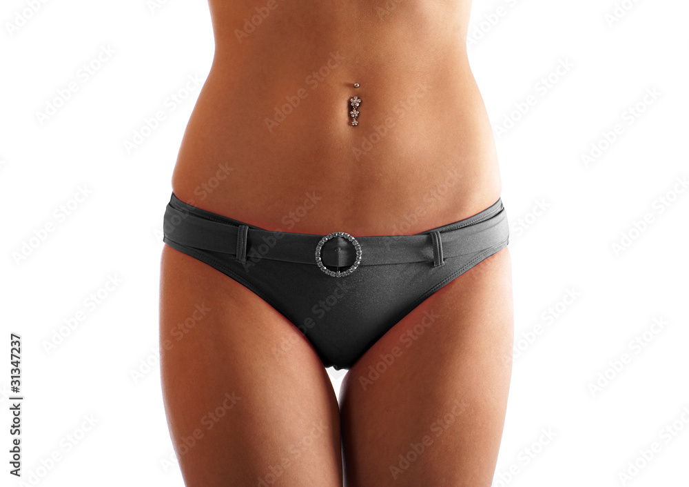 Sexy belly of a young and fit woman on a white background Sexy belly of a young and fit woman on a white background