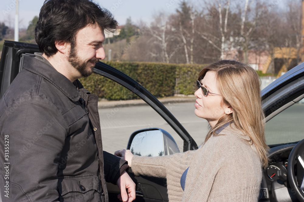 Young Adult Couple with Car