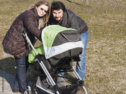 Happy Family Walking with Stroller