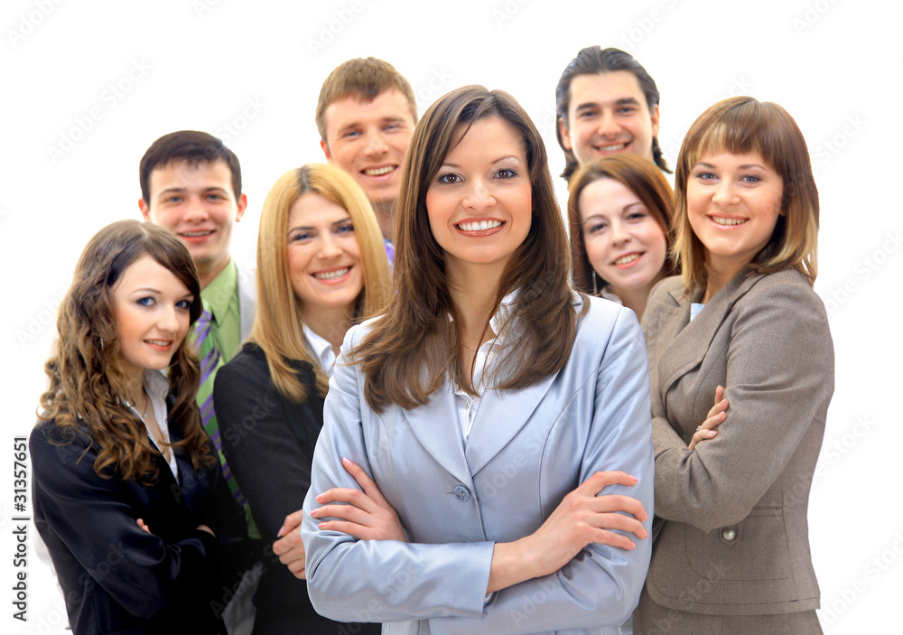 Happy young business woman standing in front of her team Happy young business woman standing in front of her team