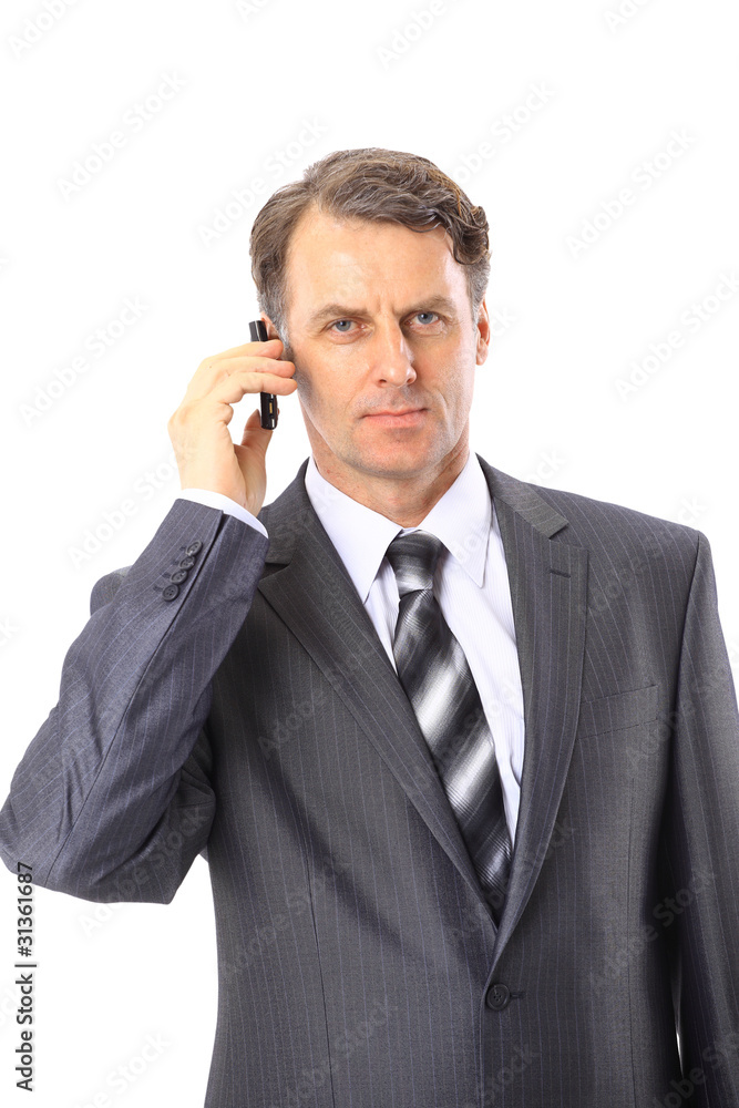 Charming businessman phoning isolated over white Charming businessman phoning isolated over white
