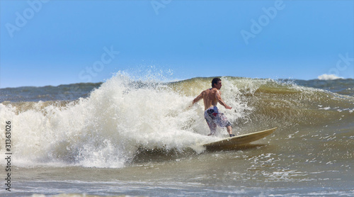 muscular surfer © Wollwerth Imagery