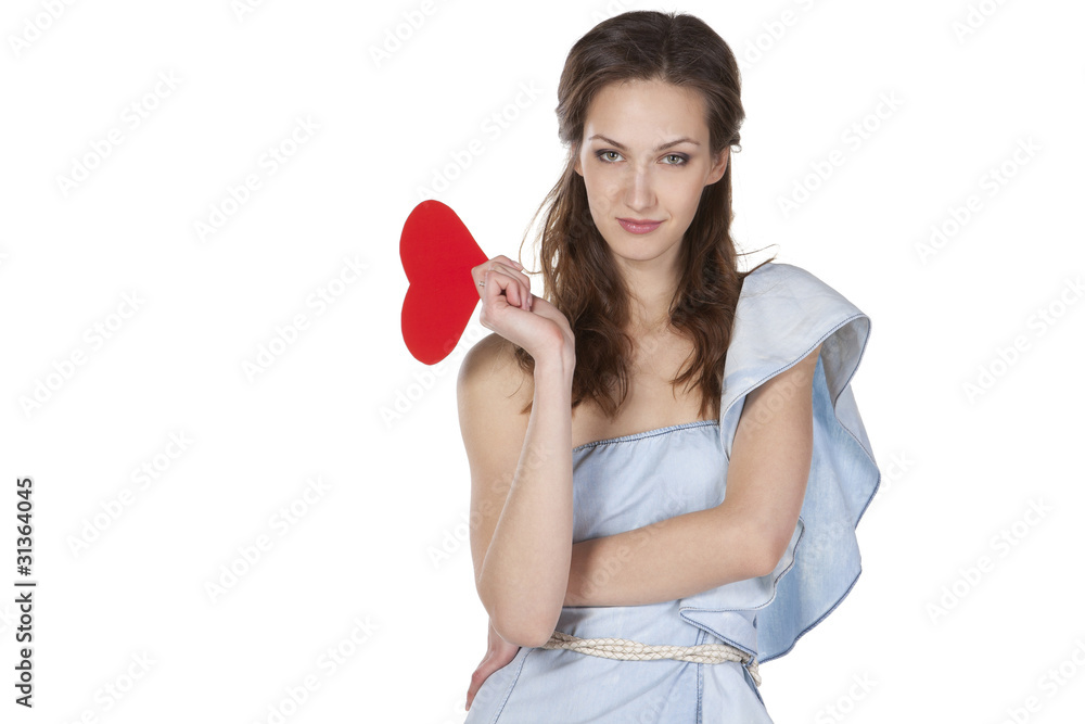 Young female in jeans dress holding heart shape Young female in jeans dress holding heart shape