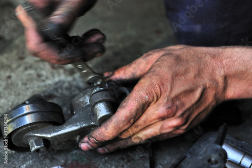 dirty,mechanic,hands,reparing,engine