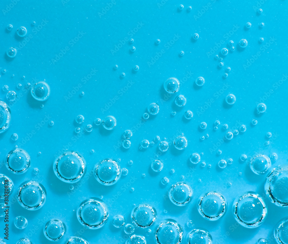 Blue abstract water with bubbles. Macro. Closeup. Horizontal.