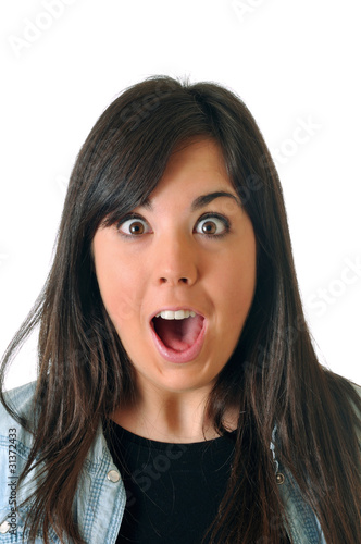 Young brown woman is surprised on white background