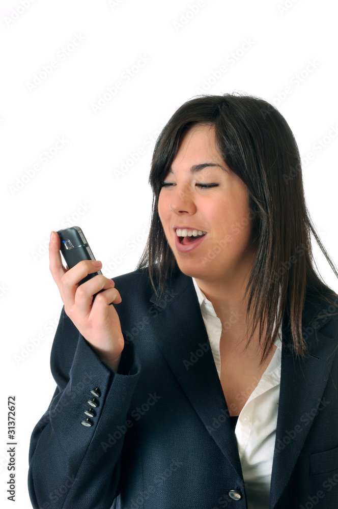 young brown woman looking happy the display of her mobile