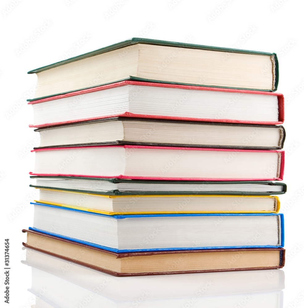 pile of new books isolated on white pile of new books isolated on white