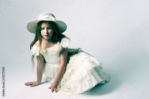 Beautiful child girl in white dress photo