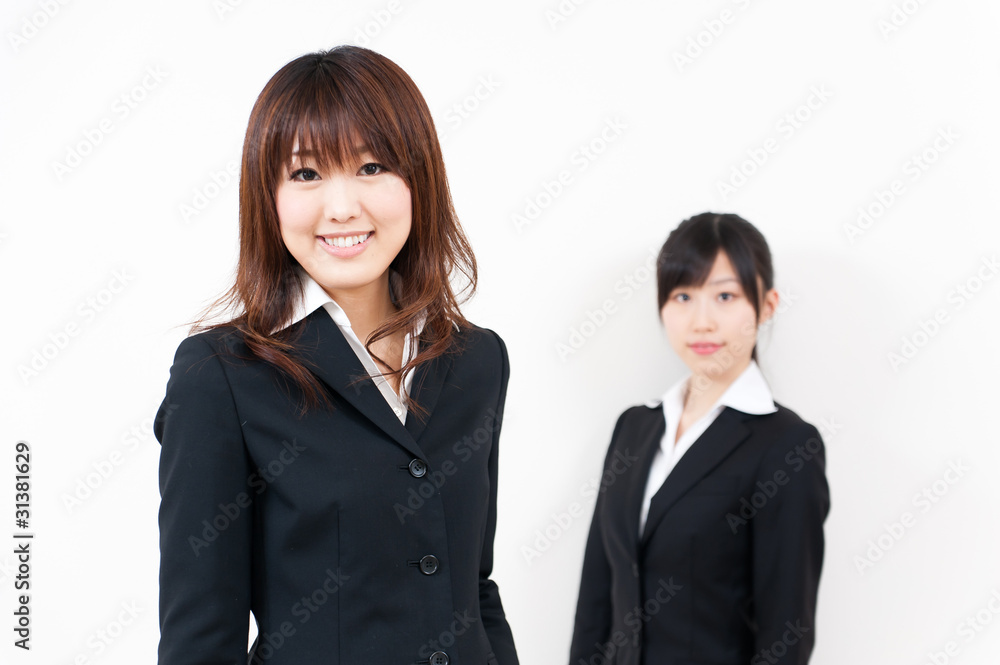 two asian businesswomen standing two asian businesswomen standing